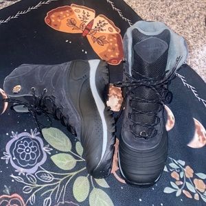 Never worn merrel snow/weatherproof boots